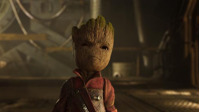 close up of baby groot wearing a zipper jacket with a determined expression on its face