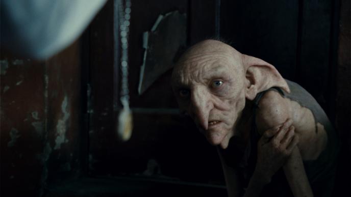 house elf kreature holding its arm