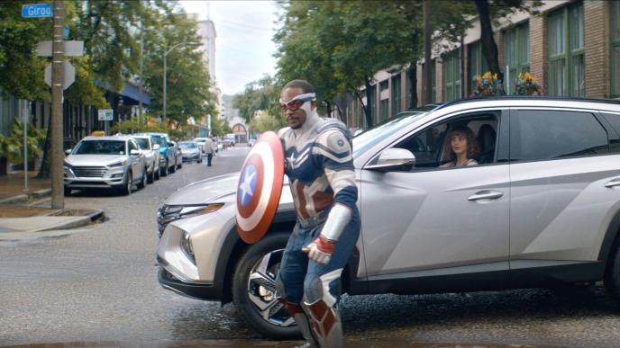 captain america standing in front of a hyundai car