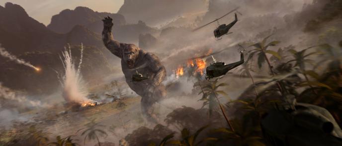 concept art of king kong fighting off helicopters. there are explosions and fire in the background