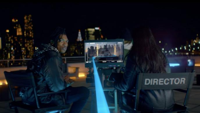 two directors looking at a camera screen on a film set
