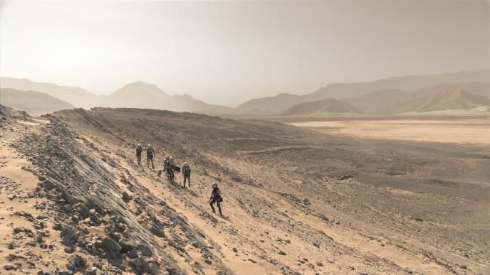 six astronauts walking down a slope on planet mars