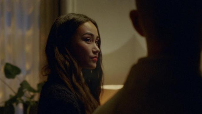side view of an actress looking at a person 