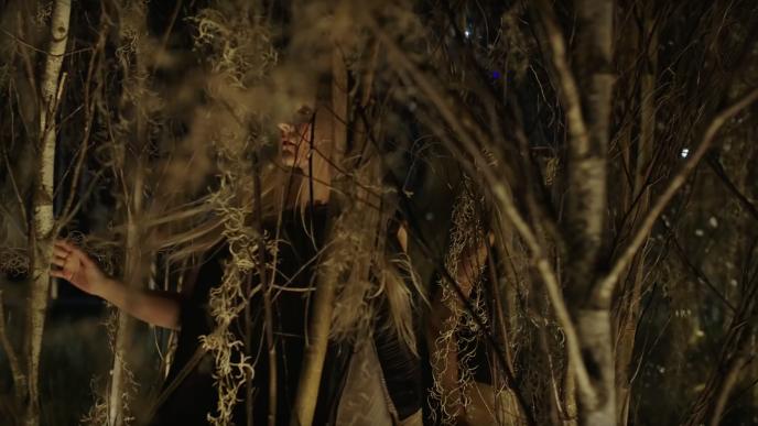 close up of a woman walking through an immersive exhibition