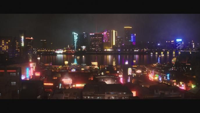 a city skyline highlighted with neon colours