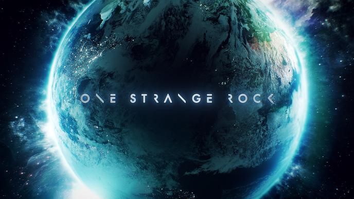 a luminous planet earth with text 'one strange rock' in the centre