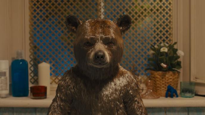 cg animated photorealistic paddington bear standing in a bathroom with drenched fur staring directly into the camera