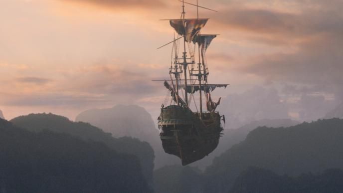 back view of captain hook's sail ship the ranger floating through air across mountainous terrain covered in trees at dusk