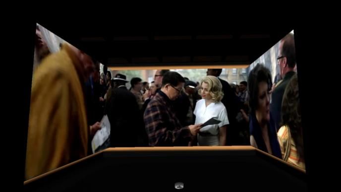 a screen with three walls of a crowd