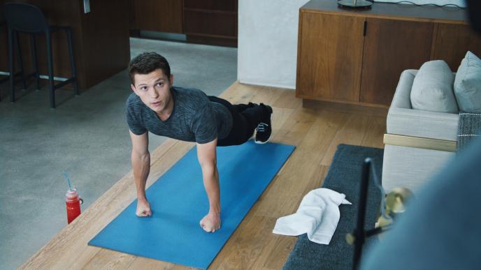 actor tom holland doing push ups on a yoga matt