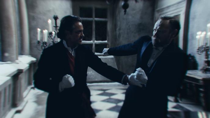 actor robert downey jr as sherlock holmes and actor jude law as john h watson fighting inside of a castle hallway