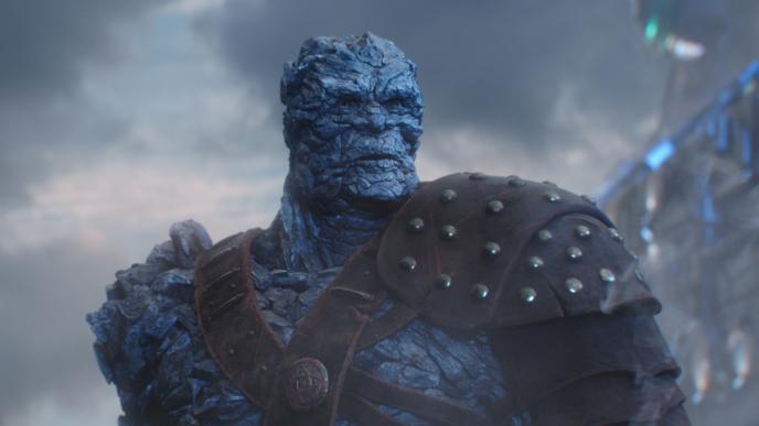 cg rock monster korg wearing war armour looking into the distance facing the right