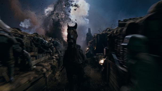 joey the horse from war horse running through the trenches in an active war zone as soldiers hold onto the edges defending themselves from an explosion