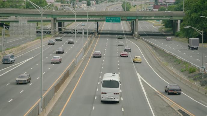 highway full of cars set in 1920s new york