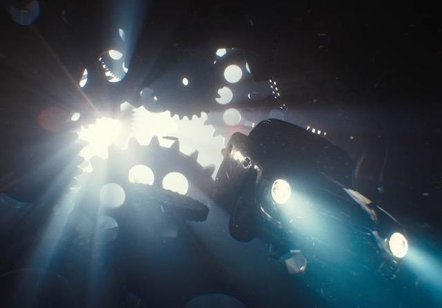 light shining through gear cogs