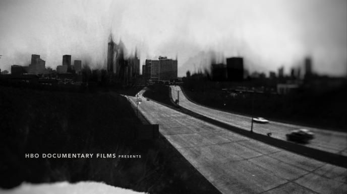 black and white blurry cityscape of a highway