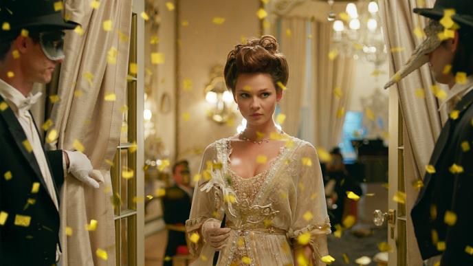 an actress walking through a fancy dress party. confetti is floating in the air