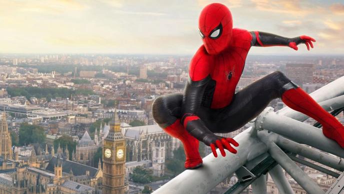 spider-man balancing on top of a high rise building in london