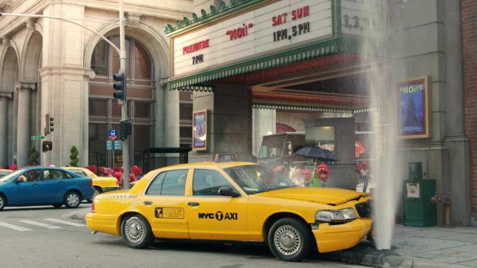 a yellow taxi in new york crashed into a fire hydrant that has water exploding out of it. there are hundreds of animal red muppet around the area