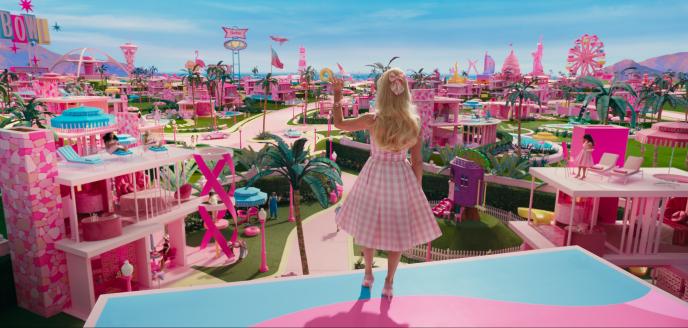 A still from Barbie showing Margot Robbie looking out over Barbie Land.