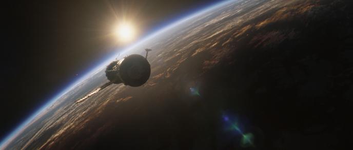 A Still from the film Gravity showing a space station above the earth.