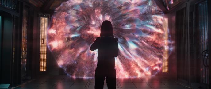The Entity pink in color, Shioli standing in front of it