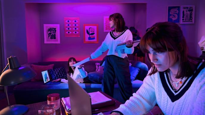 three versions of the same woman are mulitasking