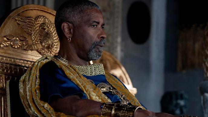 Denzel Washington in Gladiator 2, sitting on a throne