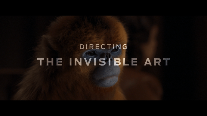 A still of a CGI golden monkey from His Dark Materials with white text over the top.