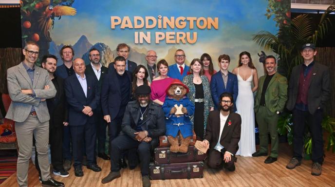A group photo of the cast of Paddington in Peru, featuring Olivia Colman, Hugh Bonneville, and animation director Pablo Grillo
