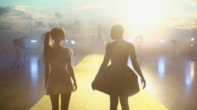 Ariana Grande and Cynthia Erivo walk down the yellow brick road