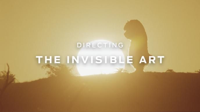 A still from Where the Wild Things Are showing a sunset with and animated creature looking down.
