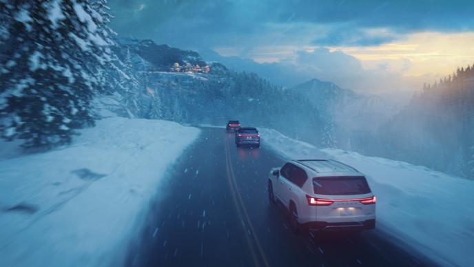 Three Lexus SUVs drive through a wintery landscape brought to life by Unreal Engine