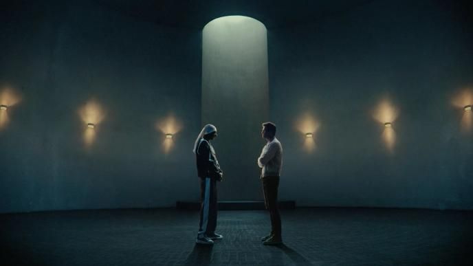 Snoop Dogg and Tom Brady stand facing each other