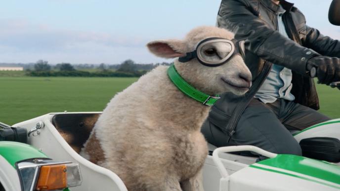 Cox Mobile's CG animated sheep named Annie rides in a motorcycle sidecar wearing goggles