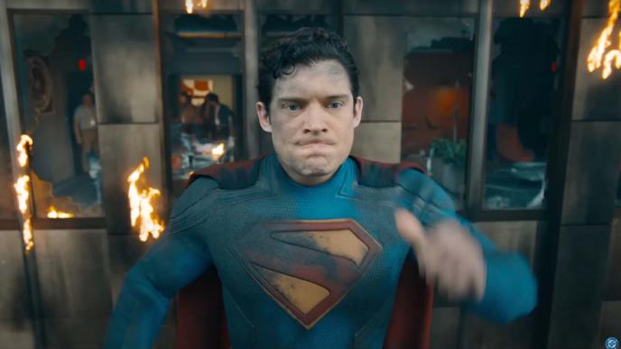 Still of Superman film of Clark Kent in in front of blazing building