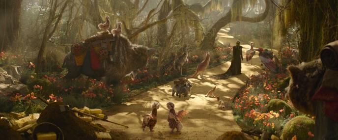 Cynthia Erivo as Elphaba in Wicked: For Good, standing in a forest with a yellow brick road, surrounded by CGI animals and vegetation