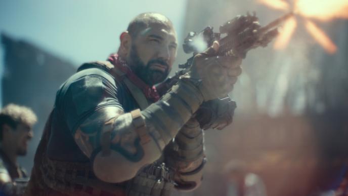 Dave Bautista fires a gun