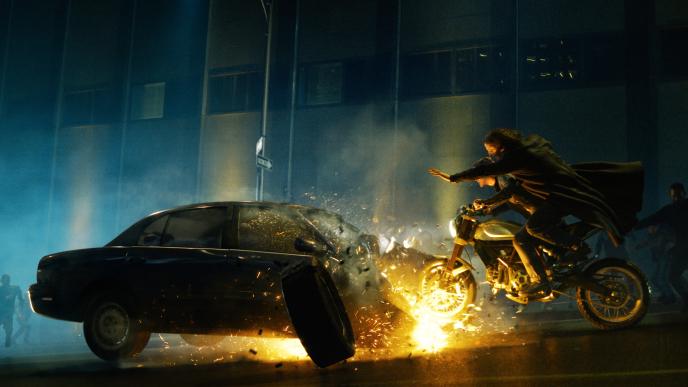 Neo and Trinity crash a motorbike into a car