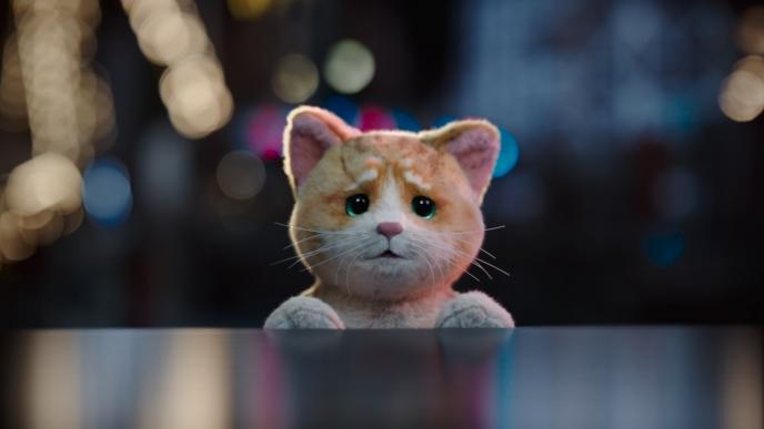 an animated stuffed animal cat with a sad expression on its face