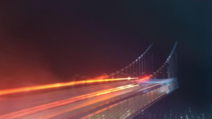A long exposure photograph of traffic over a bridge