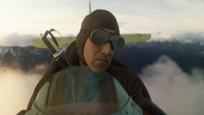 Ralph Fiennes flies a small WW2 era plane