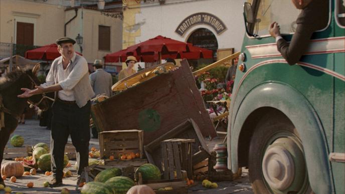 two people arguing over a destroyed fruit and vegetable stand