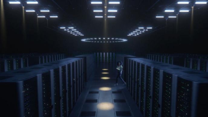 person walking through a dimly lit system room