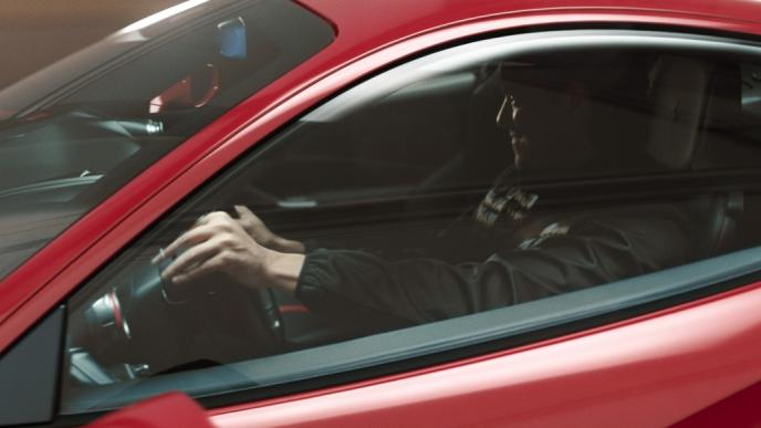 close up side view of a driver in a car