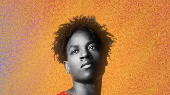 portrait shot of young person facing forward, looking into the distance in front of an orange background