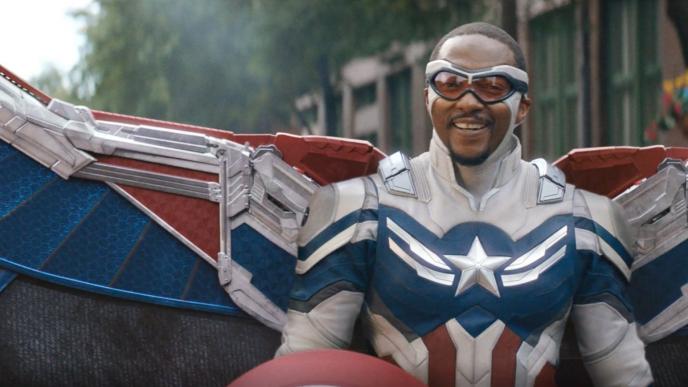 captain america smiling with flying goggles and wings spread out