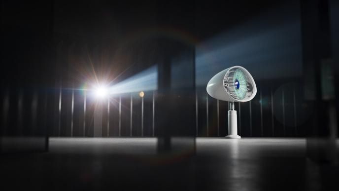 a satellite that has been animated as an eye standing strong as a light gleams behind it