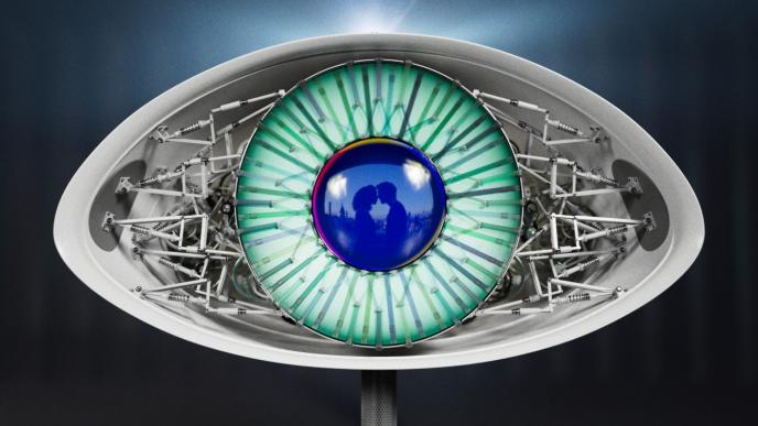 front view of a mechanical satellite eye. there is a couple embracing in the reflection of the iris