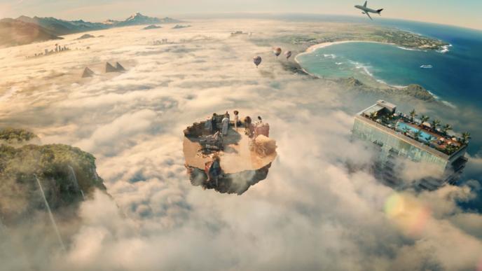 animated view of land and sea covered in clouds with landmarks peaking in between. there is a mountain with a waterfall on the left bottom corner. to the left in the distance there are pyramids, cityscapes and mountains. in the bottom centre there is a piece of land floating above the cloud with people gathered around sitting. there are hot air balloons and an aeroplane above. there is a skyscraper in the bottom right corner that has palm trees surrounding a swimming pool on the rooftop